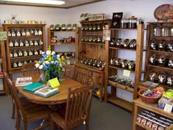 Locally Amish Made Oak Oval Table surrounded by gourmet coffee